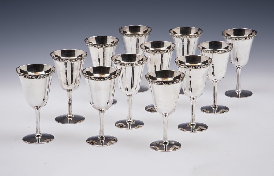 Set of 12 Cased Old Friend sterling silver wine goblets: Set of 12 Cased Old Friend sterling silver wine goblets, inset into fitted blue felt holders with six goblets each in two levels inside dovetailed cherry wood box, appx 6 1/2" T x 3 3/8" W, total comb