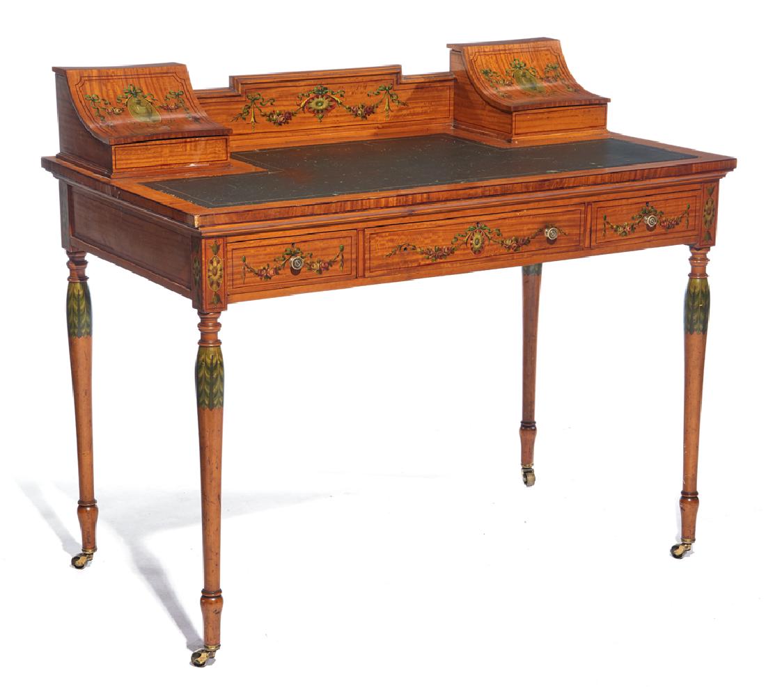 Edwardian decorated mahogany desk: Edwardian decorated mahogany desk with leather writing surface, fitted compartments with curved lids, three drawers, painted floral frieze, turned legs with floral decoration, on casters, appx 36" t x