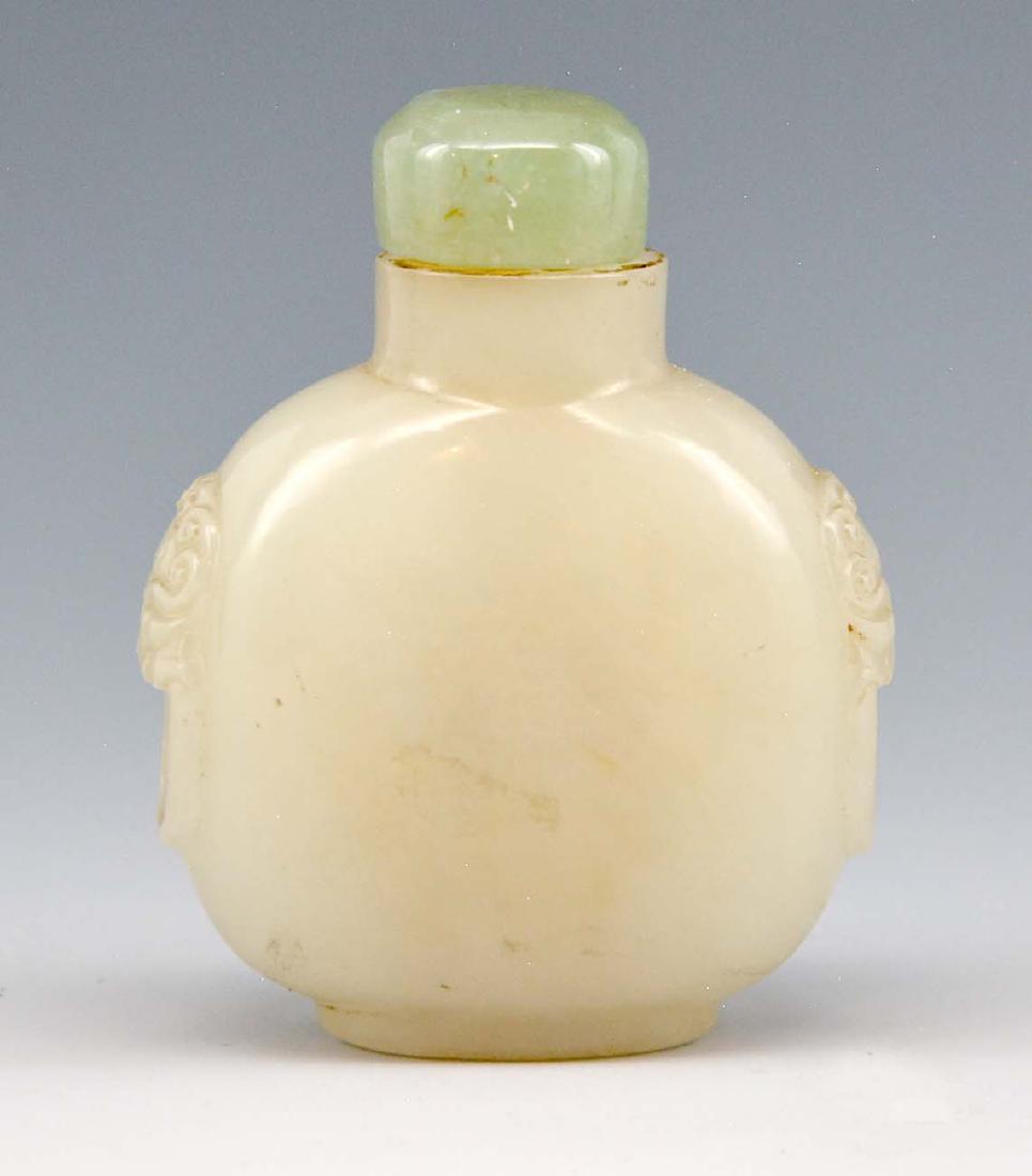 Chinese snuff bottle, jade or hard stone, carved lion (1 of 5)