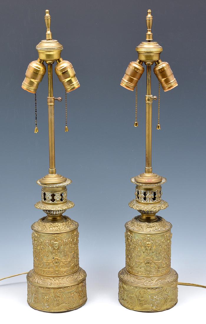 Pair of floral repousse and figural brass lamps (1 of 2)