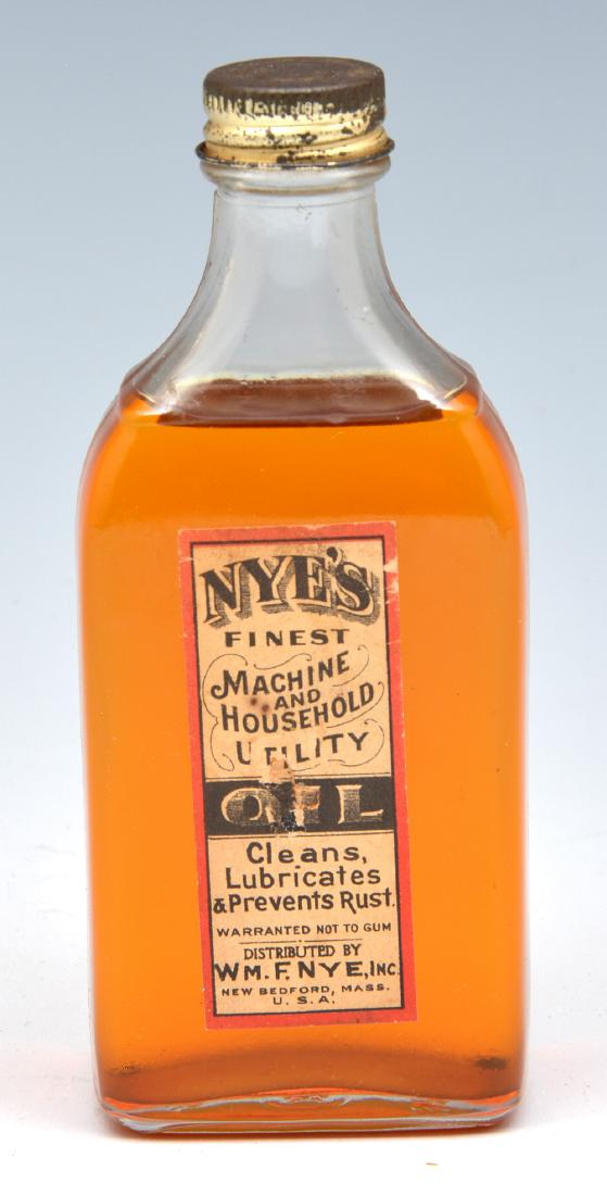 Bottle of "Nye" sperm whale sewing machine oil. 5" tall