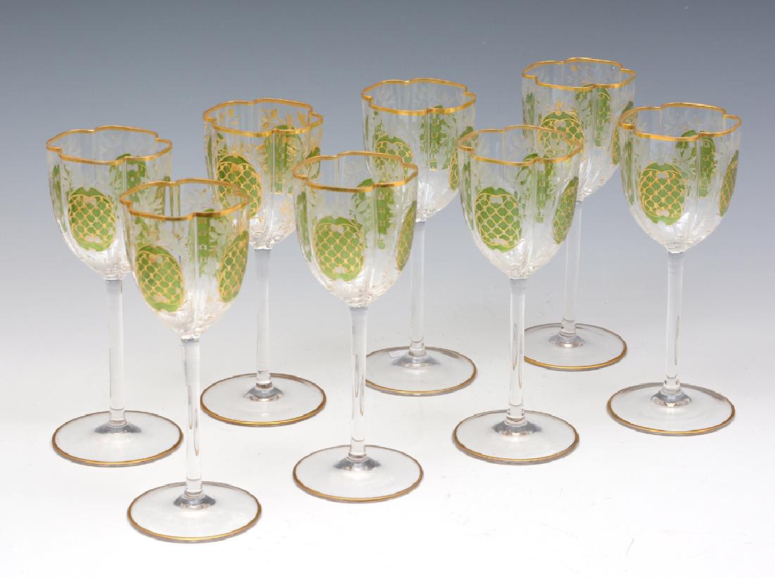 8 Moser Tall Stem Crystal Wine Glasses, 7 3/4" tall: 8 Moser Tall Stem Crystal Wine Glasses with gilt rim and detail, etched leaves, and green medallion with gilt crosshatch. 7 3/4" tall. Very good condition.
