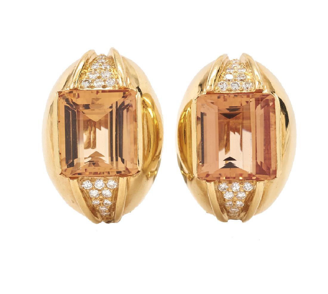 18k Gold, Imperial Topaz & Diamond Earrings: 18k yellow gold and diamond earrings each featuring one 18k yellow gold 10mm x 12mm Imperial Topaz, each with nine brilliant-cut pave set diamonds above and below the topaz, pierced "Omega" back, 16mm