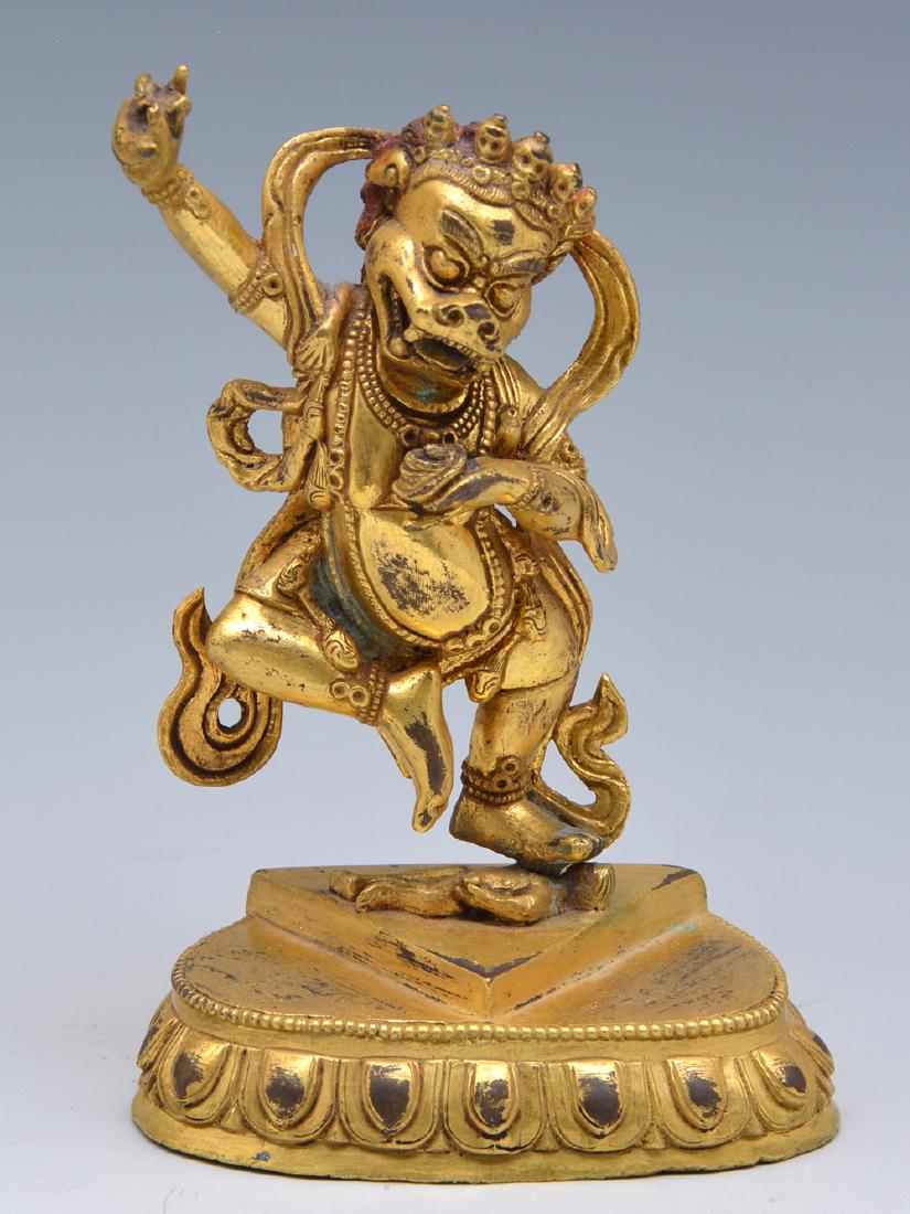 Sino-Nepalese gilt copper alloy dancing demon, 6" t.: Sino-Nepalese gilt copper alloy dancing demon, 6" t x 4" w.