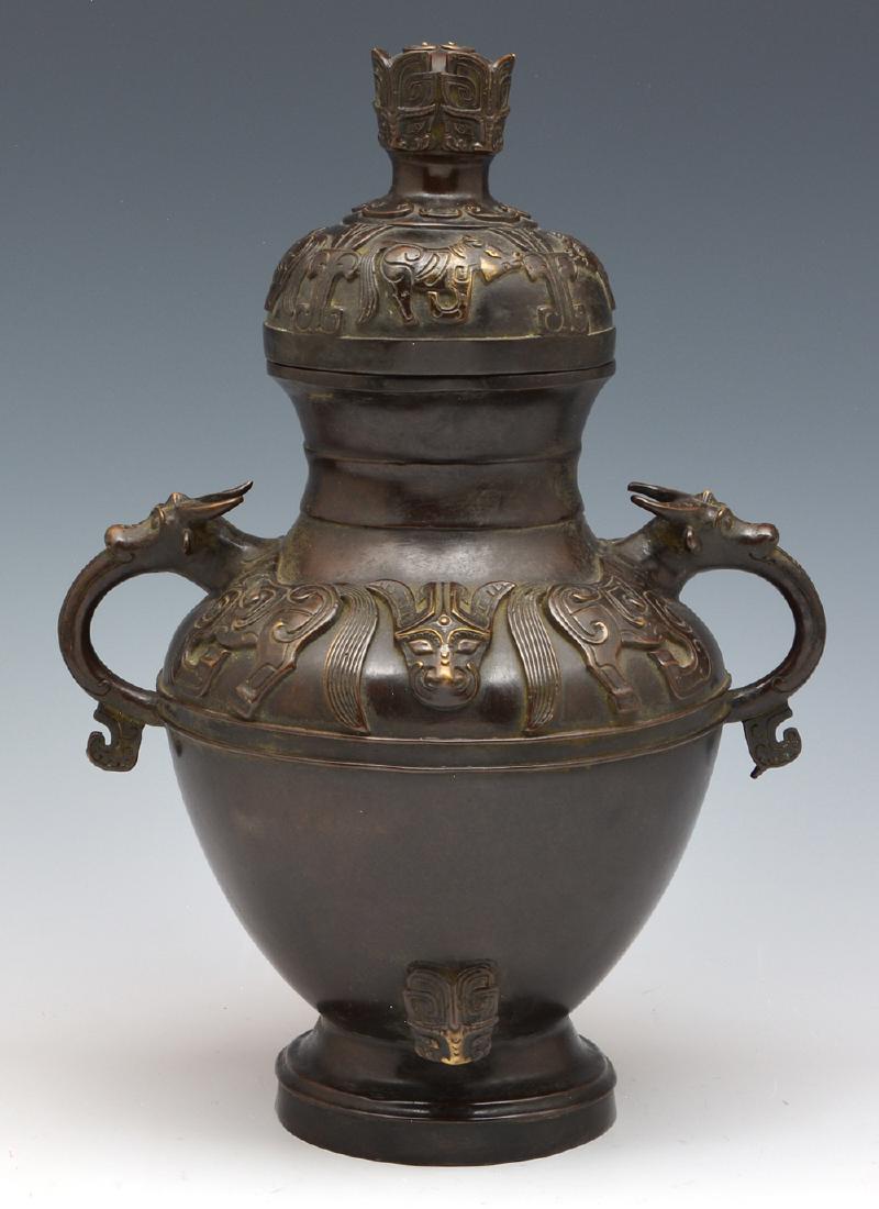 Chinese bronze covered urn with loop handles, 12 3/4"