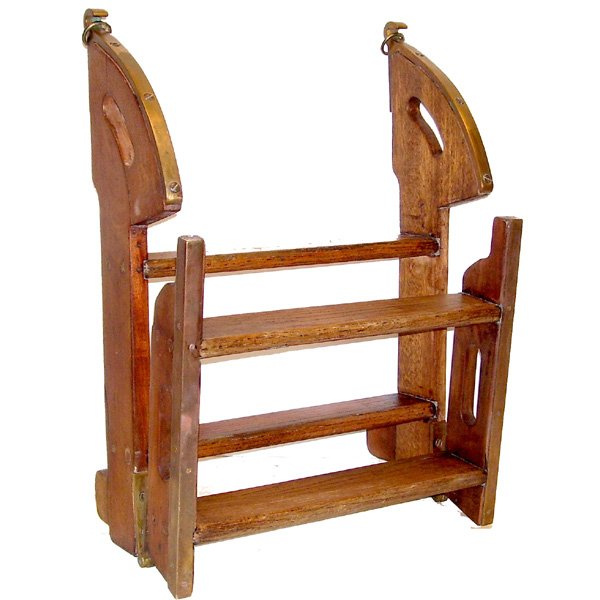 Maritime Wooden & Brass 4 Step Ladder: LADDER. Wood and brass 4 step ladder. Brass hand guards, hinges and brass decorative strips when ladder is folded. 1 hand grip has been repaired. 38" X 16 3/4".