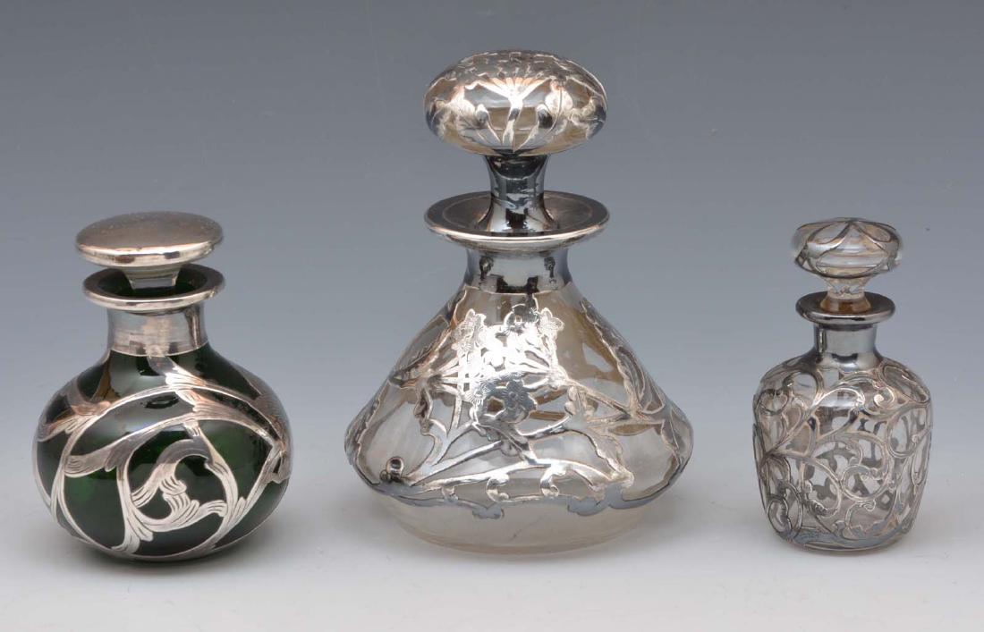 3 Silver overlay perfume bottles. Tallest: 5 1/2". (1 of 3)