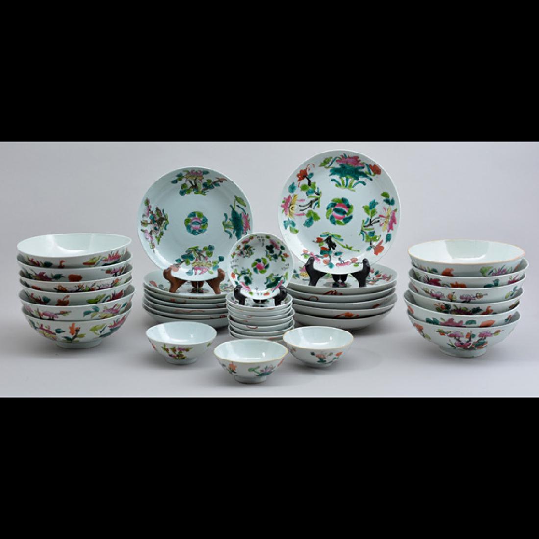 Chinese Dinner Service: Chinese Dinner Service to include: (12) bowls, (6) large plates (7) small plates, (3) cups/bowls and (9) saucers/plates, floral decorated on white ground, stamped at bottom, 9" dia. (large plate).
