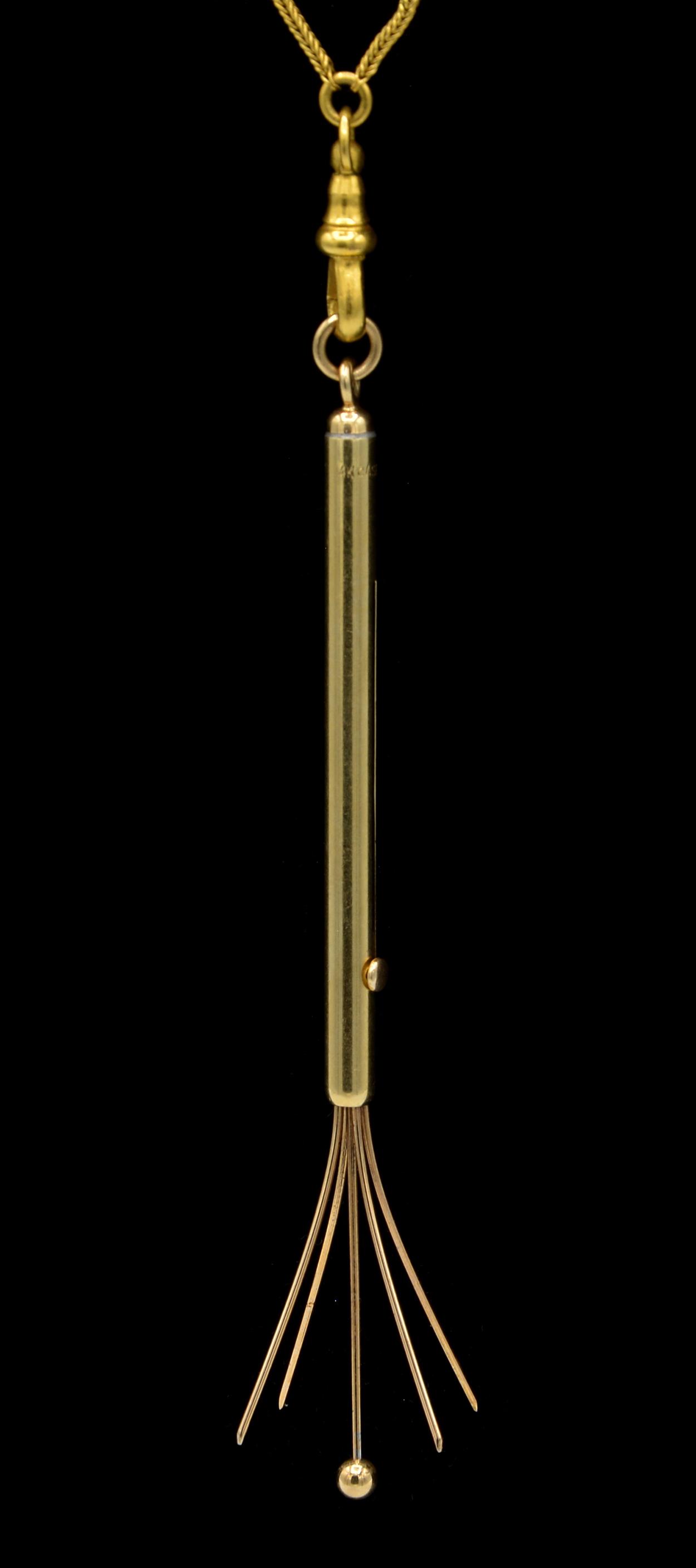 14k Victorian cocktail stirrer on gilt chain necklace: 14k Victorian swizzle stick champagne cocktail stirrer on gilt chain necklace. Retractable swizzle stick approx. 3" in length including bail, 5.7g on a 49" gilt square wheat chain.