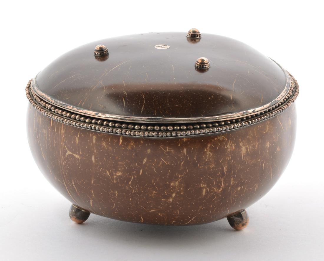 Indonesian Coconut & Sterling Silver Food Container.: Indonesian Coconut & Sterling Silver Food Container. Footed lid can be used as a plate. Appx. 4 1/2" tall x 6 1/4" dia. Very good condition.
