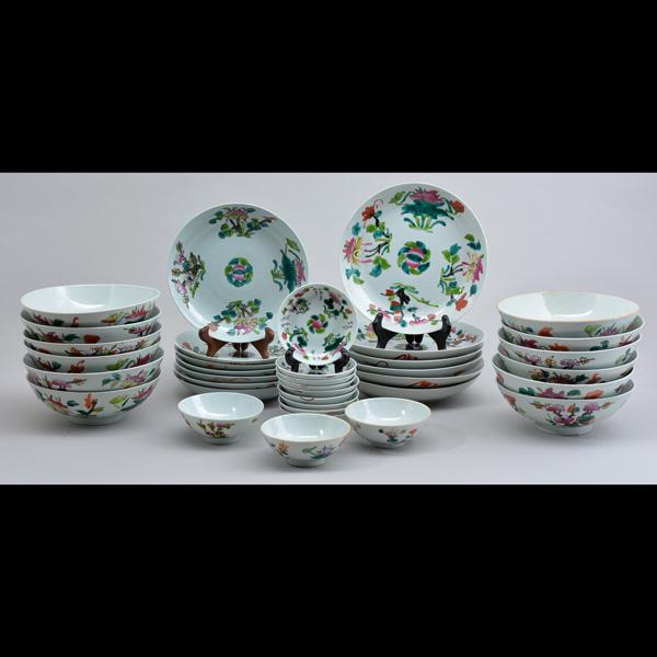 Chinese Dinner Service: Chinese Dinner Service to include: (12) bowls, (6) large plates (7) small plates, (3) cups/bowls and (9) saucers/plates, floral decorated on white ground, stamped at bottom, 9" dia. (large plate). The