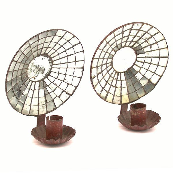 2 American Tin Mirror Back Sconces: SCONCES. Two American mirror back sconces made of tin and painted red, the flat cone mosaic mirrored back is set with a pie shaped base for the candle holder, good condition, 6" d.