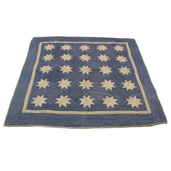 Vintage American Star Quilt: QUILT. Vintage American quilt with attractive star pattern, the ground in a periwinkle blue with white frame and a field of twenty five, eight cornered white stars, good condition, very minor spot, 77
