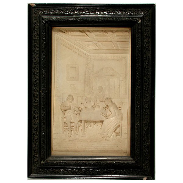 Parian Ware Bas Relief Plaque, Family Scene: PLAQUE. Cream Parian ware bas relief plaque, a family scene, reading in a paneled room, in original frame, unopened, hairline on right, 12" x 8" viewed