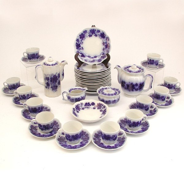 Gefle Swedish Flow Blue Porcelain Tea Set: PORCELAIN. Gefle Swedish Flow Blue tea set in the Vinraka pattern of leaves and berries, consisting of twelve cups and twelve saucers, sixteen plates, sugar with lid, teapot with lid, chocolate pot wi