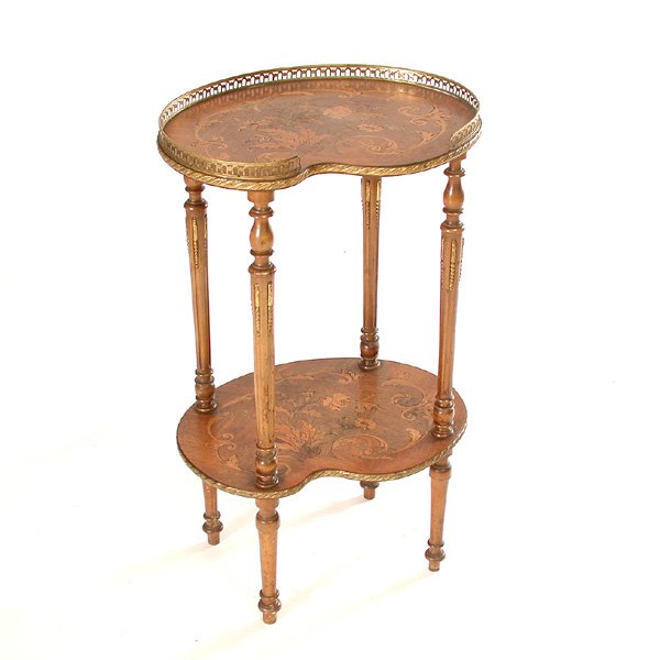 French Marquetry Occasional Table: TABLE. French marquetry occasional table, the table's palette shaped surface and lower shelf both decorated with a rose and scroll pattern with a brass gallery, the whole supported on flat and fluted
