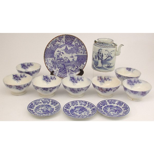 12 Pcs. Blue & White Porcelain, Flow Blue: LOT. Lot of twelve pieces of blue and white porcelain consisting of; seven English flow blue bowls in the "Peach" pattern, three Japanese saucers, one blue and white Imari style transferware cabinet p