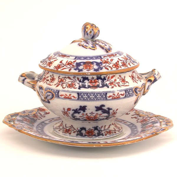 Minton Ironstone Tureen, 19th. C.: TUREEN. 19th. century Minton ironstone tureen with lid and underplate, the Imari influenced decoration consisting of underglaze blue scrolls and brocades and overglaze scrolling umber flowers all with
