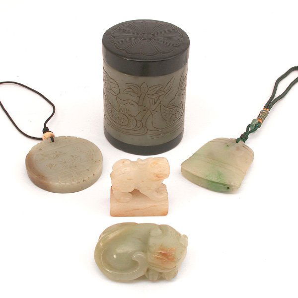 5 19th. C Chinese Jade Pendants and Carvings: CARVINGS. Five Chinese jade carvings of various types; a mottled-white rectangular seal surmounted by fu-lion, a celadon jade handling piece of a recumbent fu lion, a celadon nephrite circular pendent
