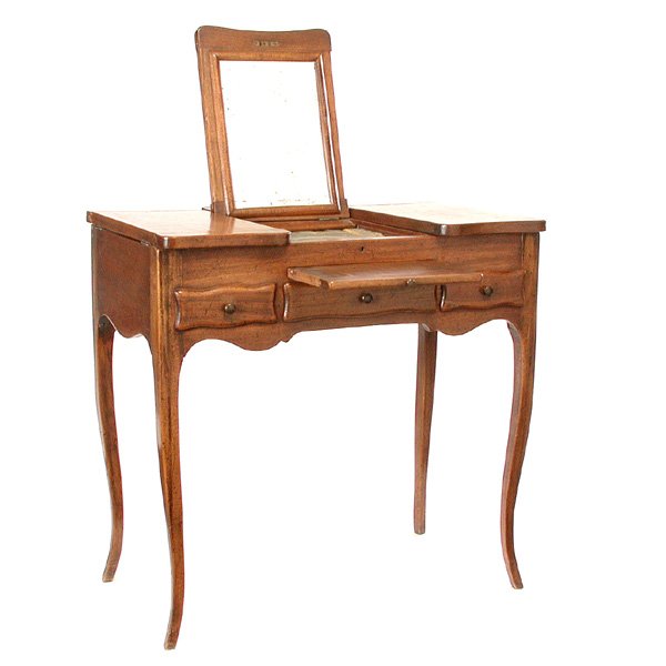 French Walnut Coiffeuse, 19th. C.: COIFFEUSE. Pretty French walnut coiffeuse, dressing table, with a shaped top, the center of which lifts to reveal a standing mirror, to either side are lift top storage bins, below is a pull out writi
