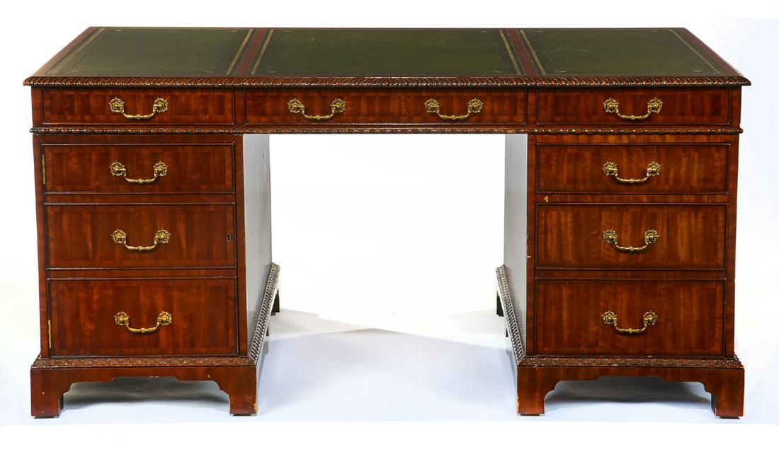 English style mahogany partners desk, 20th c.: English style mahogany partners desk with inset leather top, 20th c. 30 1/2" t x 52" w x 36" d. In good condition with minor veneer loss and missing one brass bale.