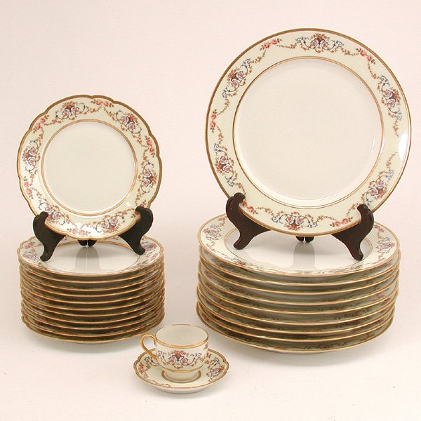 24 Pcs. Haviland & Co. French Porcelain: DINNERWARE. Twenty four pieces of Haviland & Co., Limoges French porcelain dinnerware, the verges decorated with flowering urns and floral swags surrounded by shaped, gilt rims, set consists of; twelv