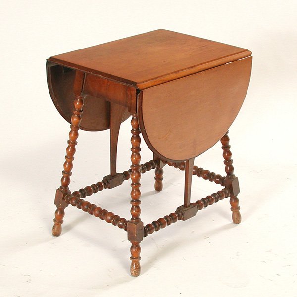 Victorian Child's Maple Drop Leaf Table: TABLE. Child's maple, drop leaf table, the top with two semi-circular leaves supported on spool turned legs, good condition, 12" w x17" d x 20" t closed, 30 3/4" w open.