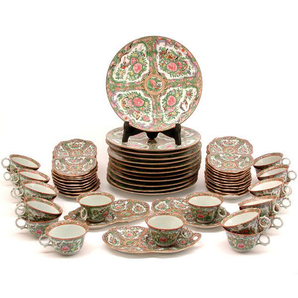 54 Pc. Set Chinese Rose Canton Porcelain: DINNERWARE. Set of Chinese Rose Canton porcelain dinnerware with four reserves of flowers, butterflies and birds consisting of; twelve dinner plates, twenty two cups, twenty saucer and cookie dishes,