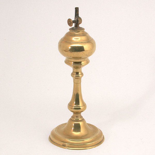 Brass Oil Lamp, Late 19th., Early 20th. Century: LAMP. Brass oil lamp bottom with baluster stand and circular base, the wick adjuster marked with manufacturer's name, late 19th. early 20th century, good condition, 11 1/2" t.