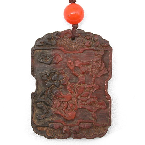 Chinese Carved Horn Pendant, Late Qing: PENDANT. Chinese carved horn pendant, possibly rhinoceros, the rectangular form carved with a scholar and acolyte alongside a bamboo grove with bat hovering overhead, the reverse incised with an inscr