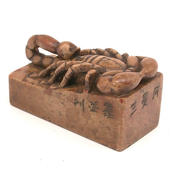 Chinese Soapstone 'Scorpion' Seal, 20th C: SEAL. Chinese carved soapstone Scorpion' seal of rectangular section with sloped top surface mounted with a well carved scorpion with curled tail, the sides incised with "Man Sun ke" dated "ren wu", (