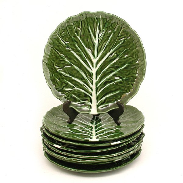 8 Portuguese Faience Lettuce Leaf Plates: PLATES. Set of eight Portuguese faience plates in the form of a lettuce leaf with fern green glaze and white center, very good condition, 10 5/8" d.
