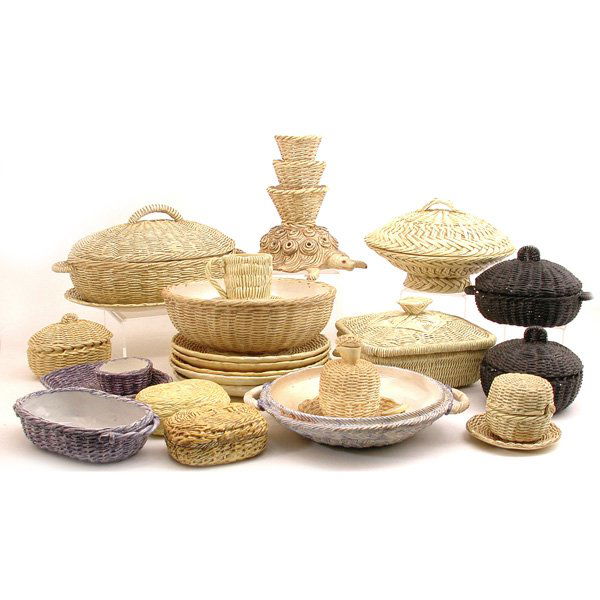 Lot of Italian Table Ware, by Annie de Garon: CERAMICS. Lot of 25 pieces of Italian matt glaze ceramic wicker weave table ware by Annie de Garon, mostly yellow ground consisting of 2 covered casseroles, divided covered server with underplate; a c