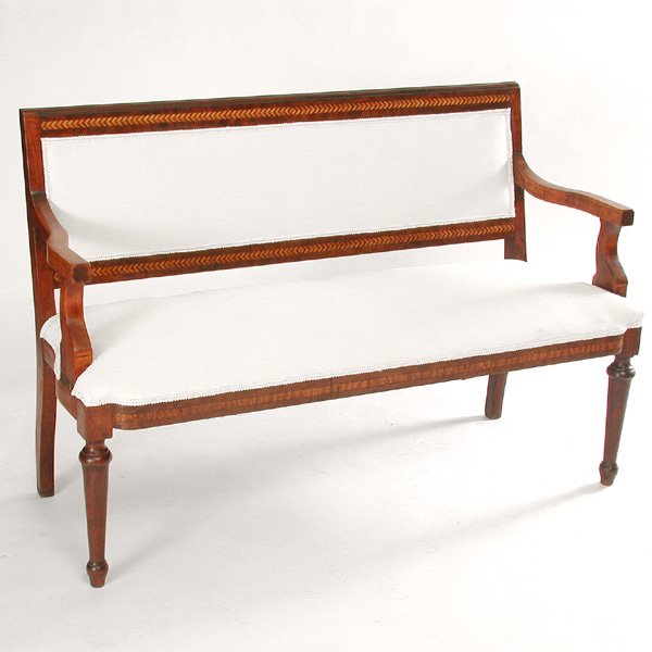 Mahogany 19th century inlaid settee: SETTEE. Mahogany and hardwood 19th century settee, having herringbone inlays, shaped arms, bowed seat rail, rising on ring and urn turned and tapered legs, upholstered in off-white cotton, 34"h x 54"w
