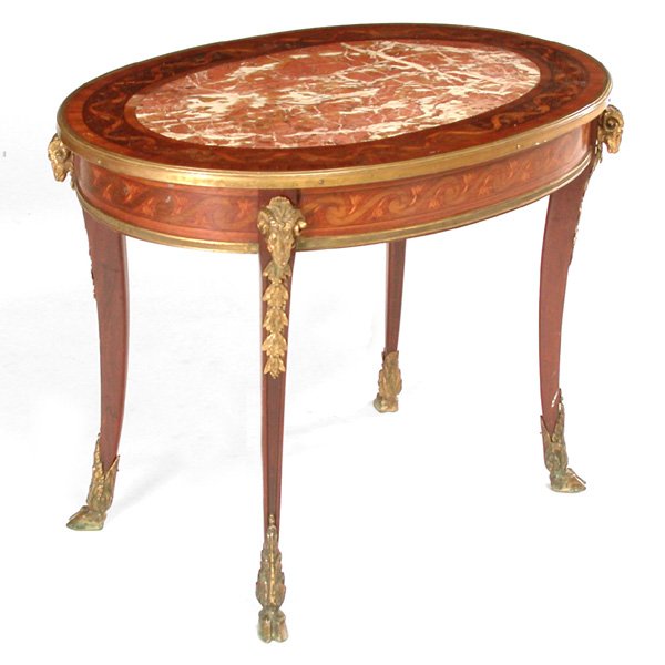 French Ormolu Side Table: FRENCH SIDE TABLE. Louis XV style, late 19th marquetry inlaid side table, oval captured variegated rouge marble top with conforming base having neoclassical ormolu mounts of ram's heads and holly, the