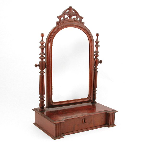 Federal Style Shaving Mirror: SHAVING MIRROR. Georgian style mahogany shaving mirror, 19th century with urn carved crest and shaped top with single drawer, 28"h x 16"w x 10 1/2"d, in good condition, loss to escutcheon, separation 