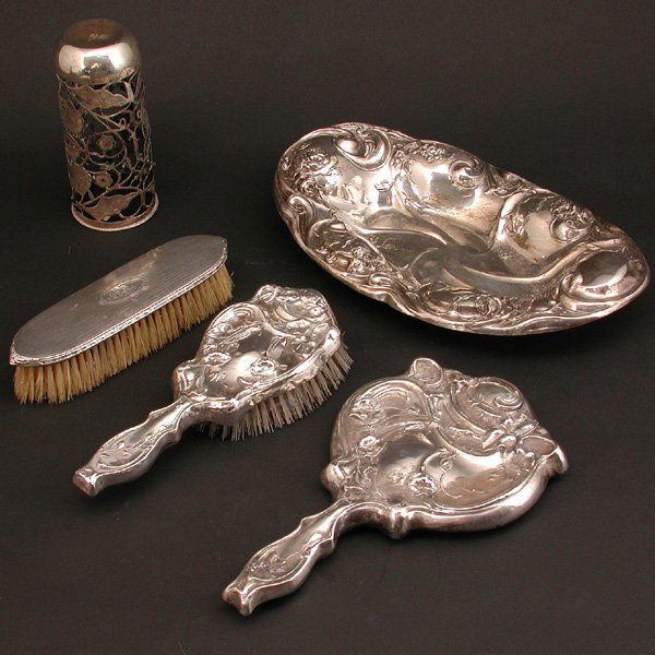 Sterling Vanity Items and Silverplate Dish: LOT. Selection of sterling silver vanity items including an art nouveau hand mirror and hairbrush, a clothes brush monogrammed 'BFG', a Mexican sterling floral openwork bud vase cover, together with a
