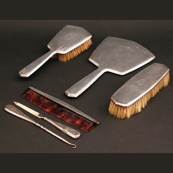 Wallace Sterling Vanity Set: VANITY SET. American sterling silver vanity set by Wallace, having stripe pattern and comprising hairbrush, clothes brush, comb, hand mirror, nail file, and button hook, monogrammed 'Anne', overall in
