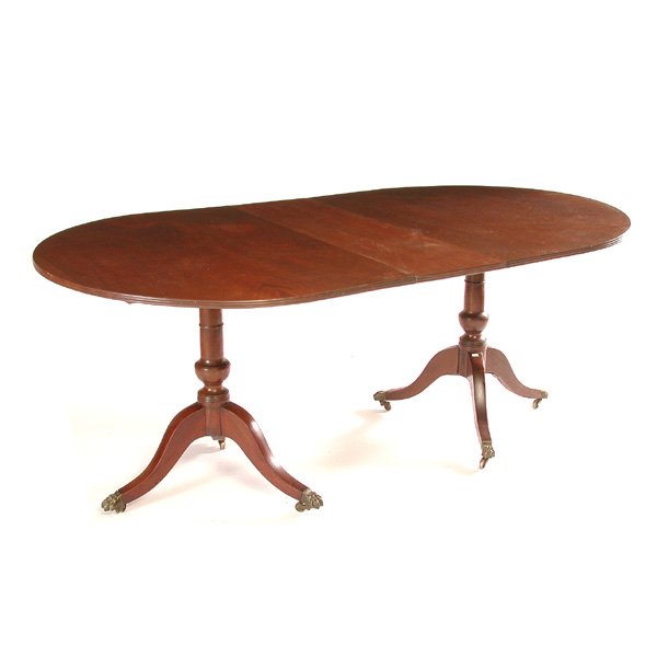 George III Duncan Phyfe D-End Breakfast Table: TABLE. George III Duncan Phyfe style double pedestal mahogany breakfast table consisting of two sections with tilting tops supported by ring and urn standard, rising on down swept legs terminating in