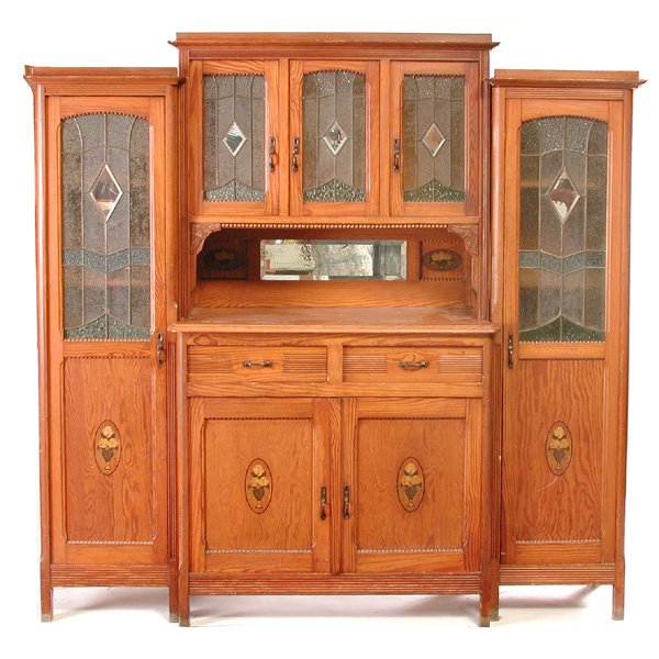 English Pine Buffet / China Cabinet: BUFFET. English pine buffet or china cabinet, circa 1915, with stained and leaded glass panels all centered with lozenge shaped mirror panels, having stepped center with three cabinet doors, two silve