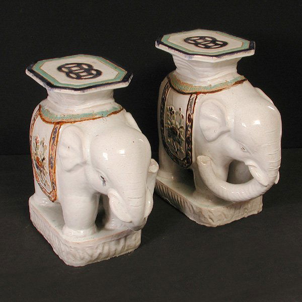Chinese Glazed Earthenware Elephant Garden Seats: PLANT STANDS. Pair of Chinese glazed earthenware elephant form garden seats, 22"h x 10"w x 21"d, wear, fading to polychrome.