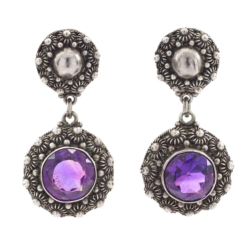 Amethyst and silver earrings: Amethyst and silver earrings with faceted amethyst in filigree setting, stone measures 9.5mm, total weight 9.4g.
