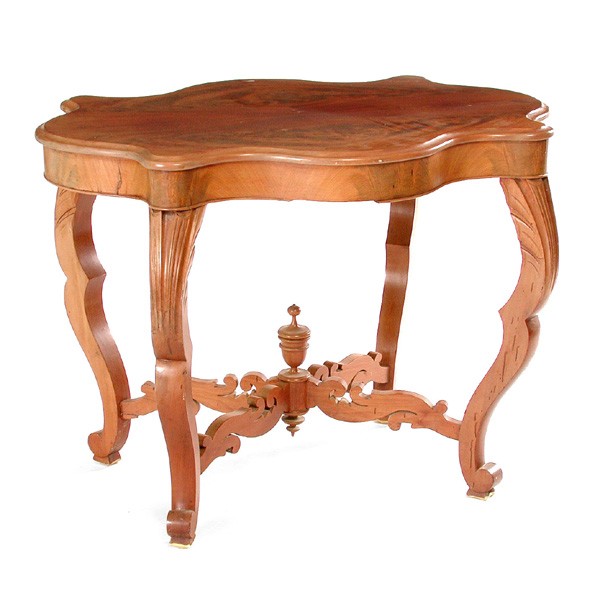 Mahogany Turtle Top Table: TABLE. Mahogany turtle top table having carved stretchers joined by turned urn form finial, 27 1/2"h x 38"w x 27"d, in good condition.