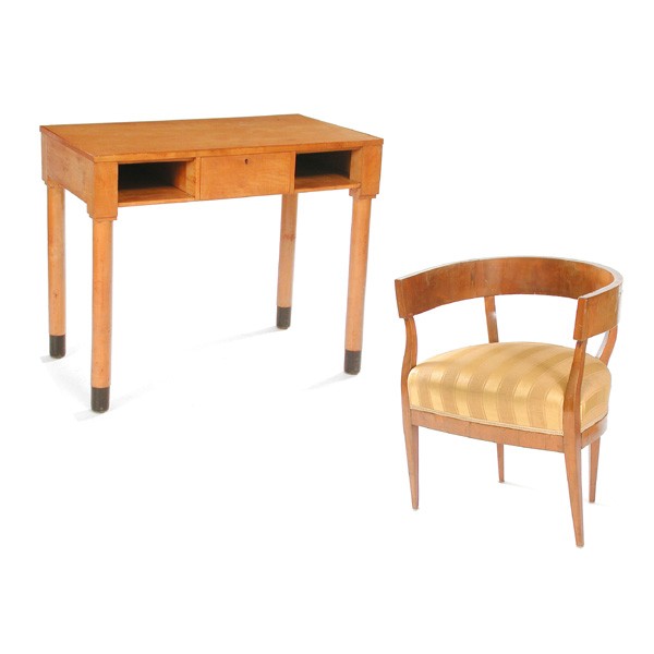 Biedermeier Desk and Armchair: DESK AND CHAIR. Biedermeier desk having a single drawer flanked with two open compartments, rising on turned legs with ebonized ends, with a Biedermeier armchair having barrel back and tapering legs, 