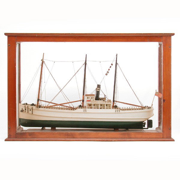 Cased Ship Model: SHIP MODEL. Wood framed ship model flying the American flag, nicely detailed in wooden case, 21"T by 33"W by 11"D, very good condition, lacks glass on right side and back glass panel replaced with ple