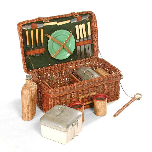 Early 20th C. B. Altman Picnic Basket: BASKET. Early 20th c. picnic basket handmade in England for B. Altman & Co., NY, the interior outfitted with wicker covered bottles, porcelain lined lunch containers, plates, and supplies, basket meas