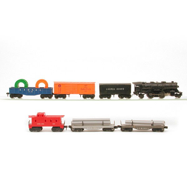 Lionel No. 1110, 1002, 1004, 1007: TRAIN. Lionel train set including: Ste+ Scout Tender 1110, Freight Car 1002, Freight Car 1004, Freight Car 1007, 2 Metal Flat Cars With Pipes.