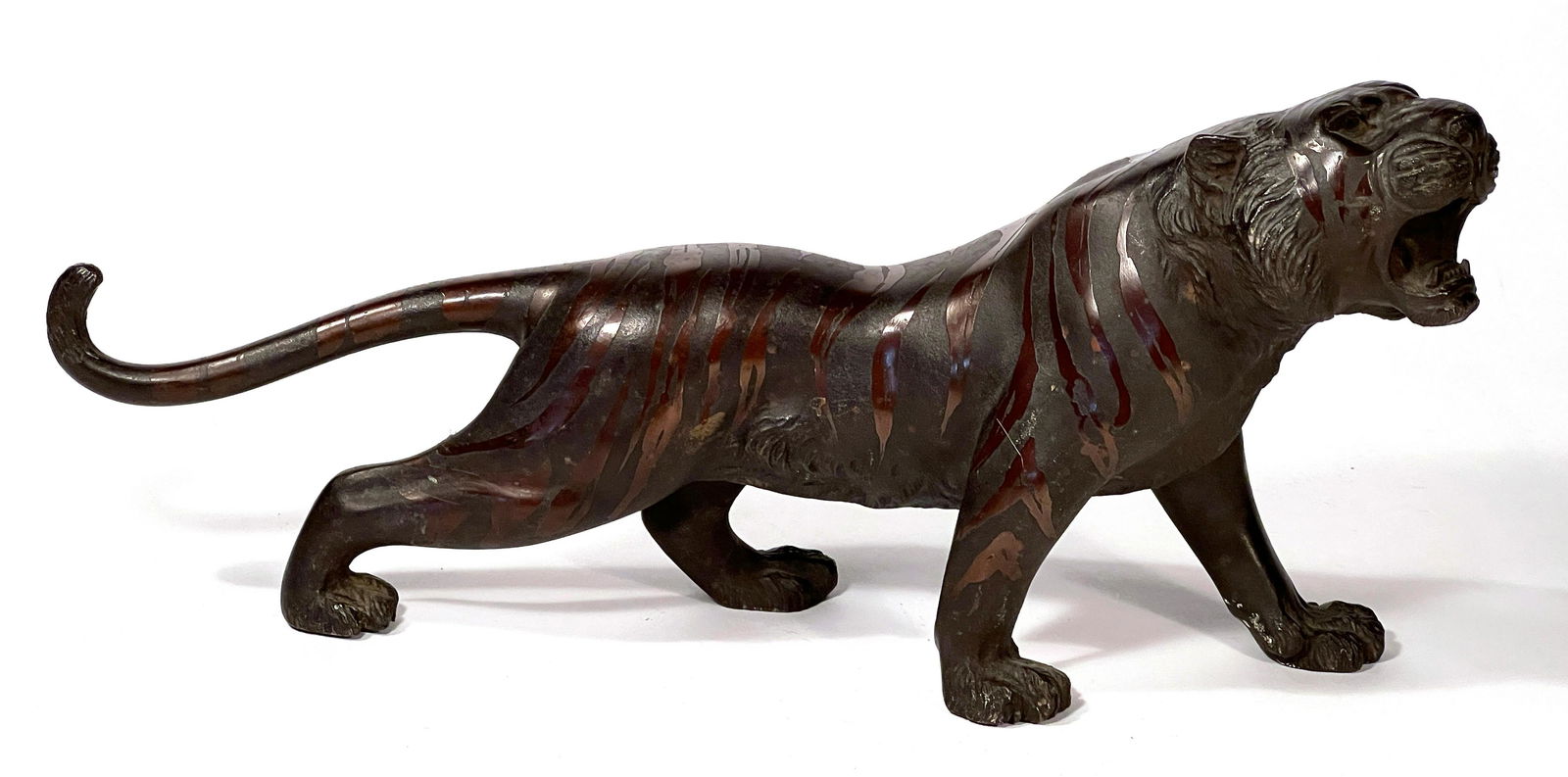 Japanese Meiji Period Bronze Tiger, signed: Japanese Meiji Period Bronze Tiger, signed on belly and in original patina. Appx: 5 1/2" tall x 12" in length