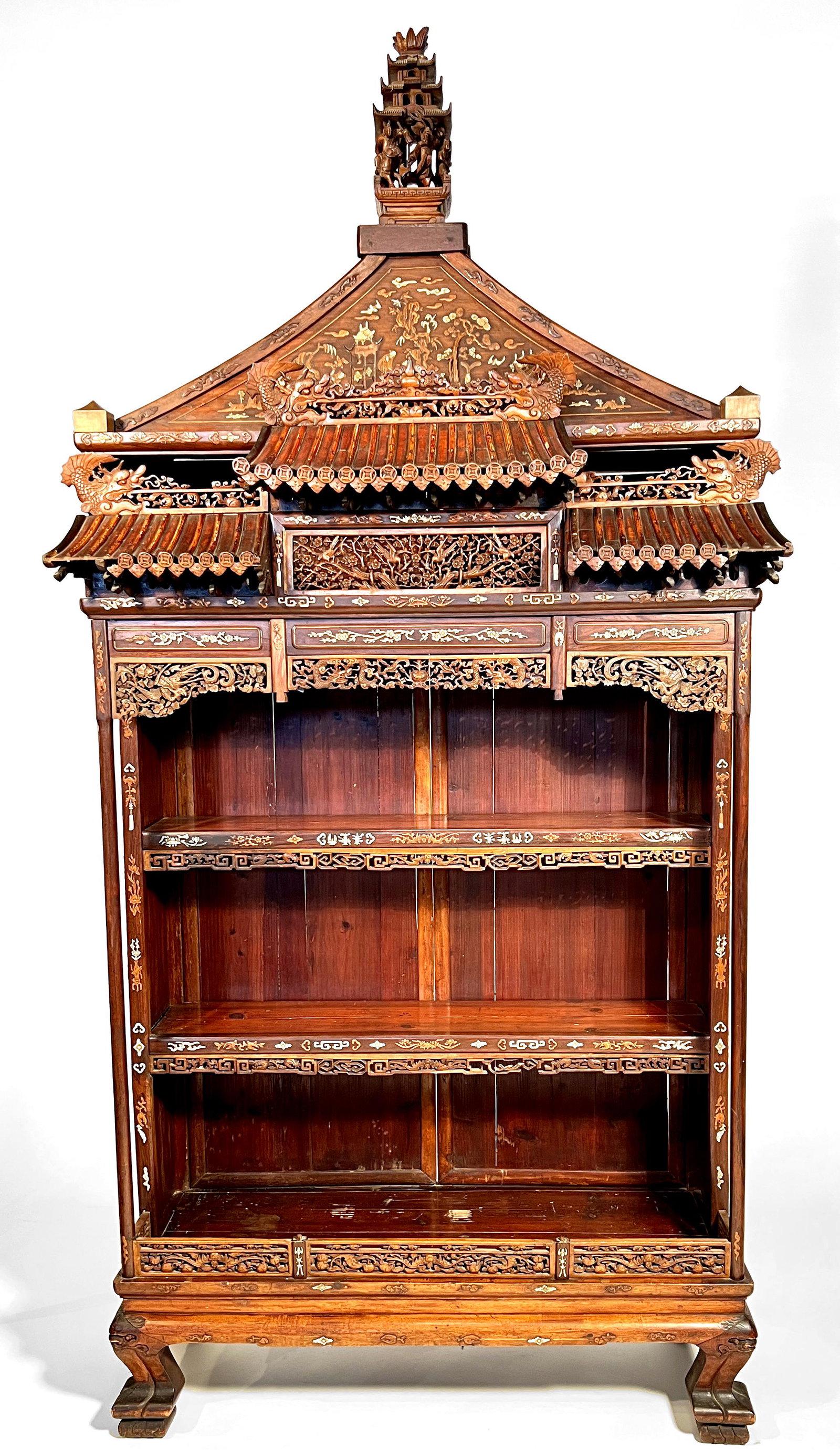 Chinese inlaid open front cabinet, 19th c: Chinese inlaid open front cabinet with carved figural Pagoda finial above a stylized pagoda top with intricate inlay, dragons and through carving. The open front with 3 shelves above a platform base w