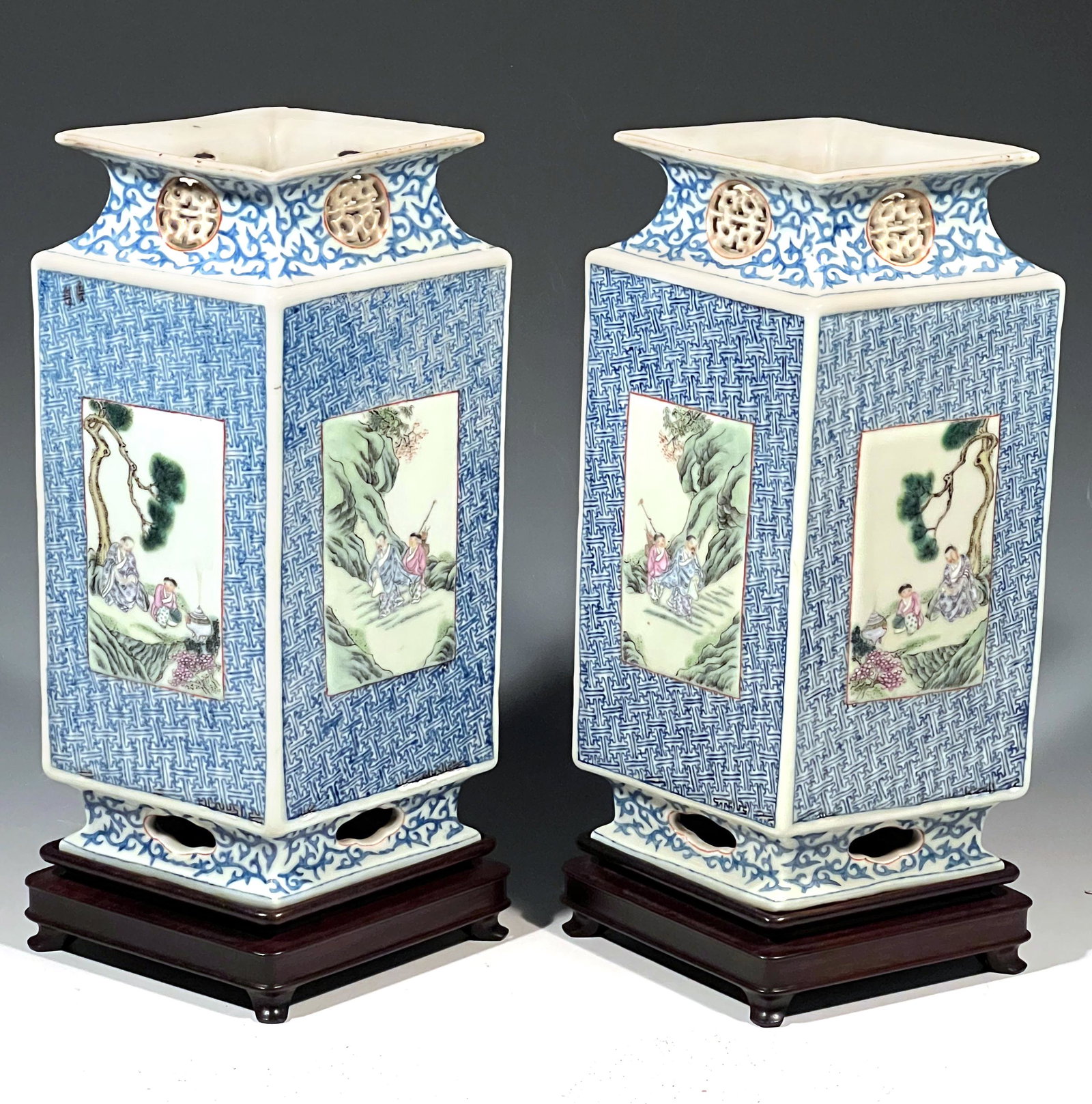 Pair of Porcelain Diamond Shaped Vases on Stands.: Pair of Porcelain Diamond Shaped Vases on Stands with scenic and figural panels. Mark on bottom. Appx. 12 1/2"t x 8"w x 5 1/2"d. 14 1/4"t on stands.